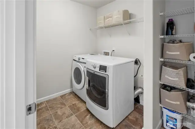 Upstairs Laundry room with storage and spacious work space!