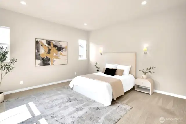 Wake up to soft light and peaceful surroundings in the primary bedroom.