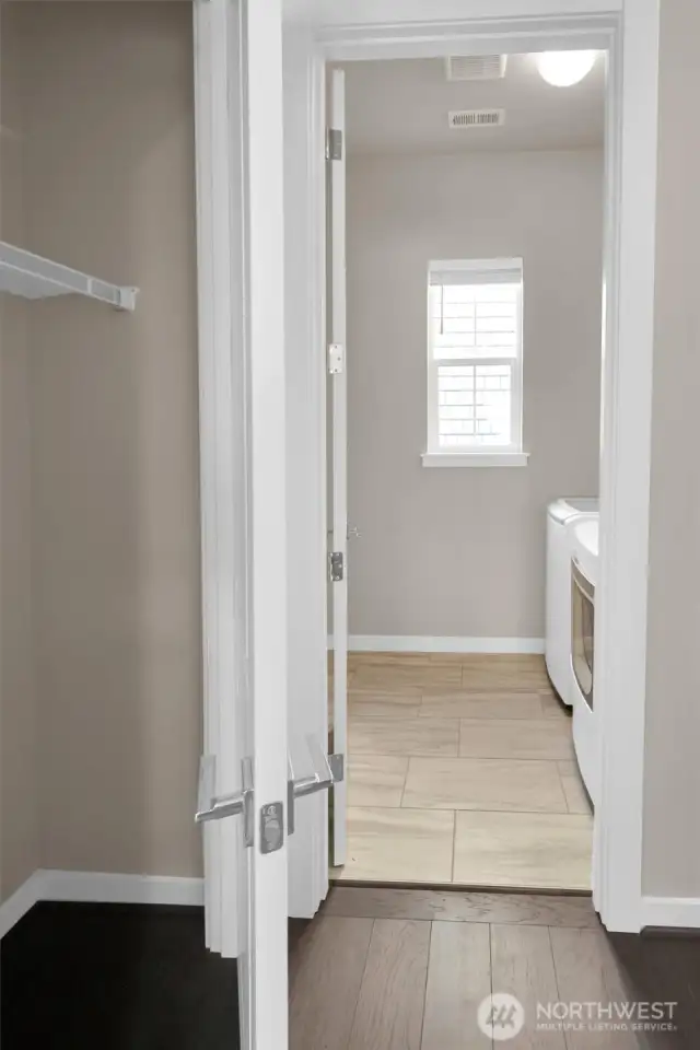 Dedicated laundry space with plenty of room to fold and organize.
