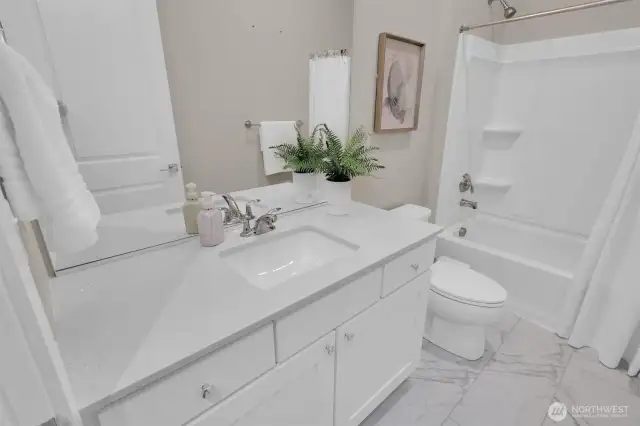 Full second bath with contemporary finishes.
