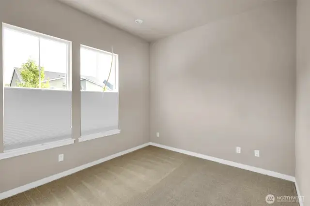 Bright and inviting secondary bedroom with ample closet space.