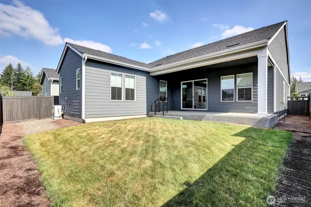 Low-maintenance backyard with room to relax or garden.