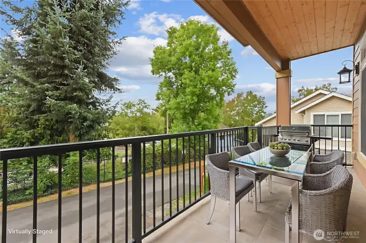 Covered BAlcony of the Primary Bedroom on upper level. Virtually Staged