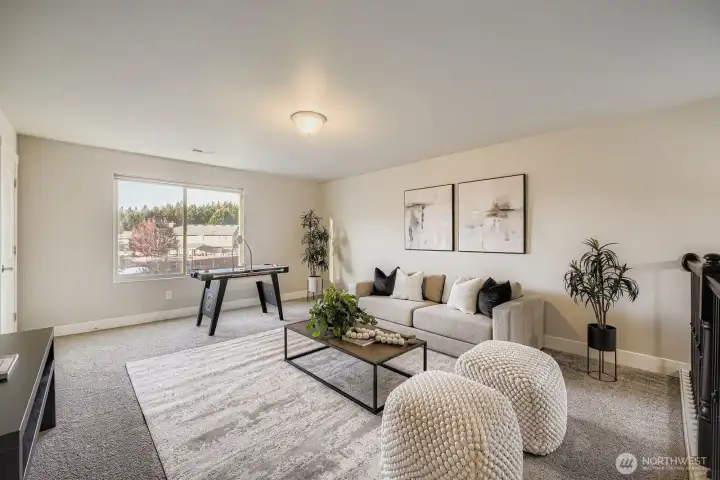Second floor loft space with a small closet.
