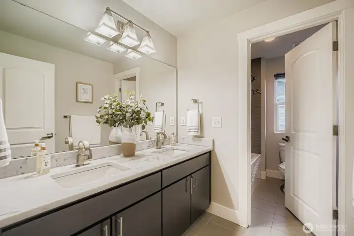 Full bath off hallway serving the three bedrooms.