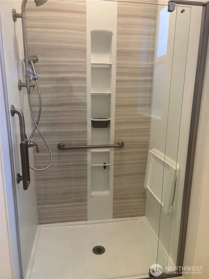 Walk in shower with seating area