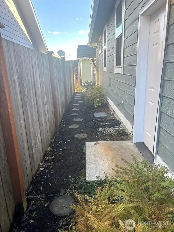 Walkway along side of home