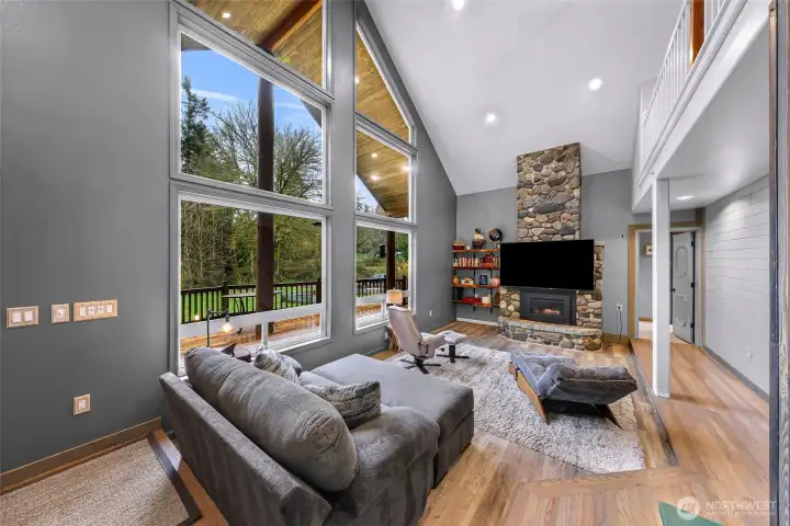 Oversized Windows with a River Rock Fireplace