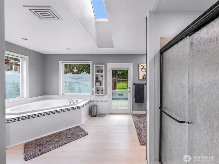 Jetted Bathtub in the Primary Bath with Back Deck Access