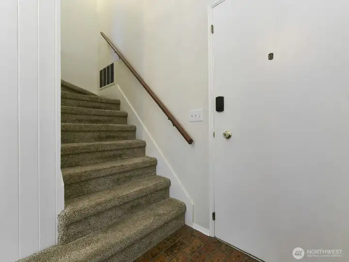 Front entry. Stairs going upstairs to bedrooms.