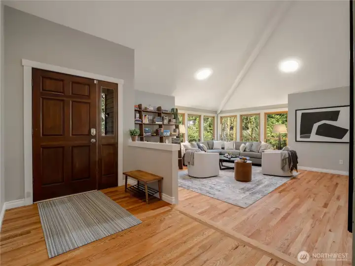 The neutral color palette flows throughout, w/gleaming hardwood floors, vaulted ceilings, & wood-wrapped windows that frame the lush Pacific Northwest landscape at every turn.