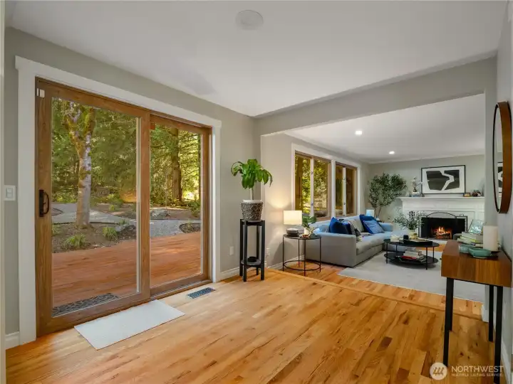 Ideal space to add an informal dining area. The sliding doors open to the the expansive back deck & private gardens. A spacious greenbelt provides privacy & a tranquil backdrop year-round.