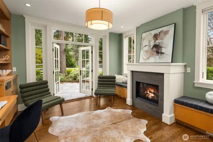 Executive office with hearth and adjoining flagstone patio.