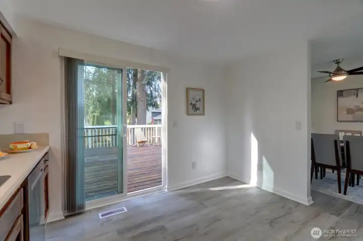 Kitchen sliders lead to big deck for entertaining guests.