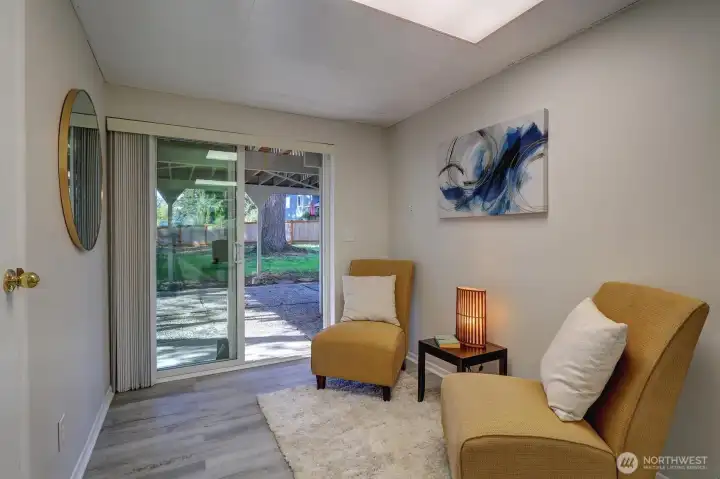 Downstairs rec room sliders lead to nice patio area under the deck. Door on left accesses laundry room.