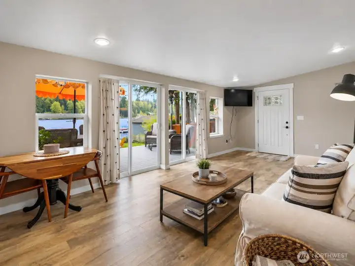 Great room with 2 sliders out to the deck.  Partial virtual staging.