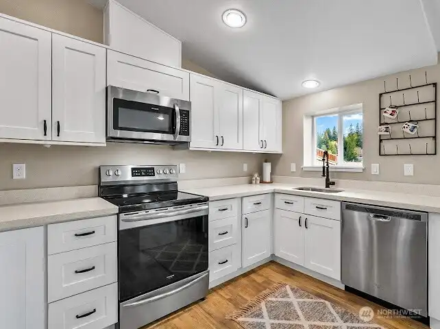 Stainless appliances and an abundance of cabinets.