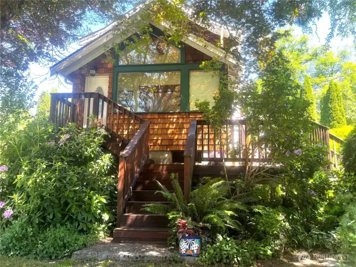 Front of the house with wrap around ironwood deck.