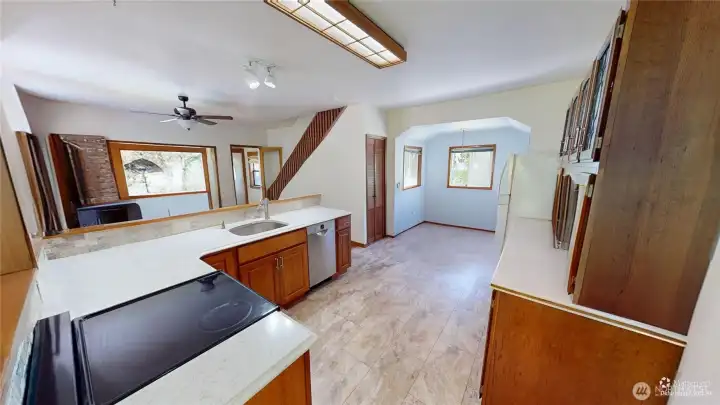 Showing the kitchen and the dining room.