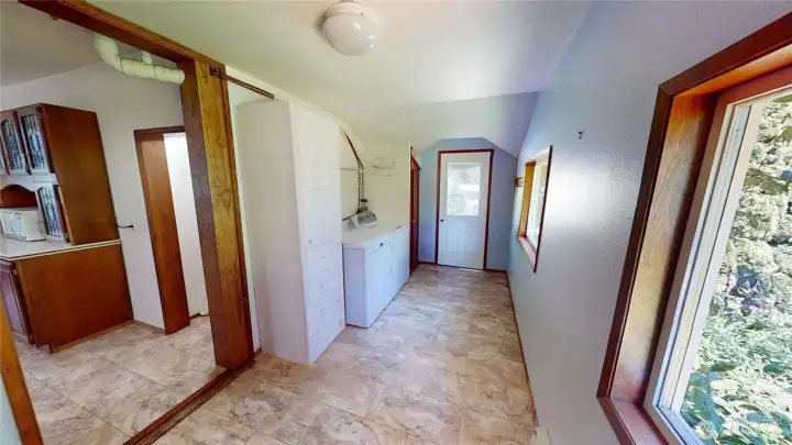 Looking down the hallway at the back door.