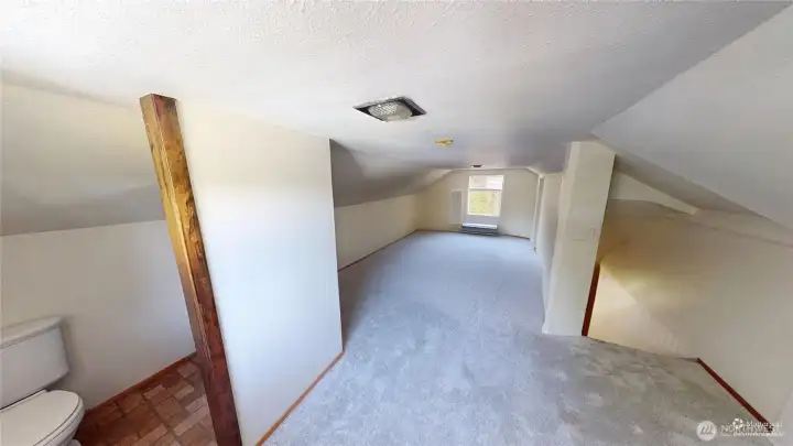 Bedroom upstairs with a half bath.