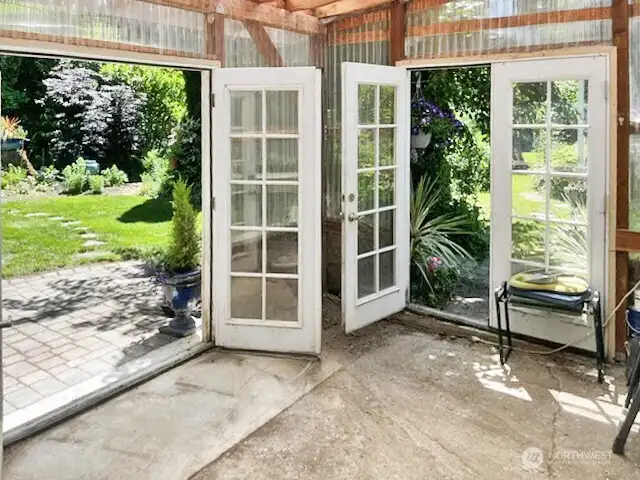 Showing both sets of french doors in the greenhouse.