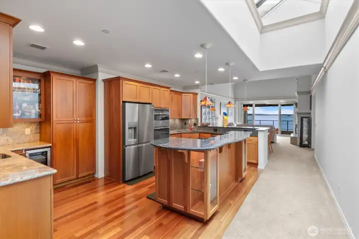 Designed for effortless entertaining, this beautifully updated kitchen is the heart of the home. Rich hardwood floors, upgraded appliances, an open-concept layout, and sweeping views of the Sound combine to deliver a truly exceptional living experience.