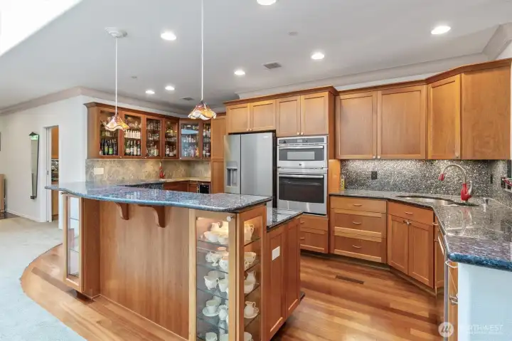 Imagine a top-notch kitchen where every detail shines. You’re preparing a special dinner as friends sit at the counter, enjoying the show while sipping wine. The space is light, bright, and open, with sweeping views that make the room feel endless. Every element—from the gleaming surfaces to the effortless flow—invites connection, conversation, and delight.