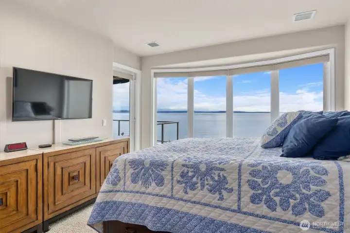 View facing Primary opens onto the snowcapped Olympic Mountains, offering a serene and breathtaking panorama. The crisp, white peaks contrast beautifully against the sky, creating a tranquil and inspiring backdrop visible right from the comfort of the suite.