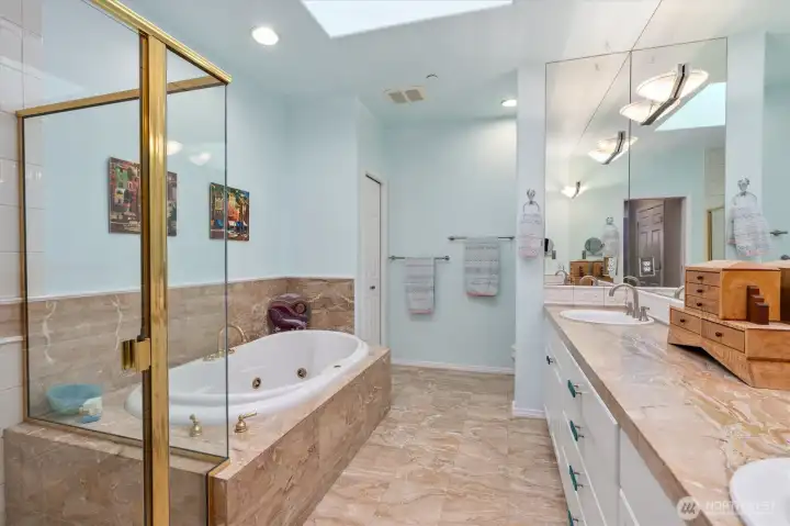 In the primary bath you'll find a relaxing soaking tub and separate shower provide versatile options for your morning routine.