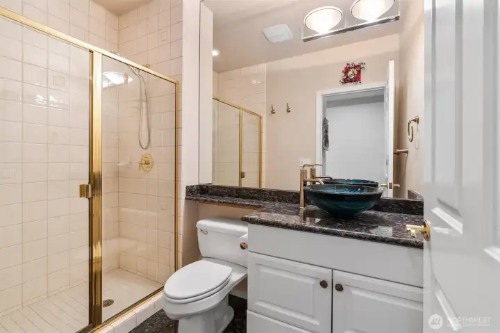 The 3/4 guest bath is right next to the guest room for an almost en suite feel.