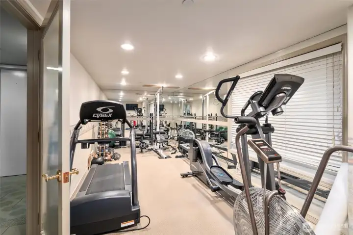 Bay Villa offers a thoughtfully curated collection of amenities designed to support both convenience and lifestyle. Residents enjoy a well-equipped fitness room, perfect for maintaining an active routine without leaving the building. The welcoming lobby provides a warm and inviting entrance for guests, creating an immediate sense of comfort and hospitality. In addition, a dedicated workshop space with tools and a workbench is available for hobbies, repairs, or creative projects—an uncommon and highly valuable feature for condo living.