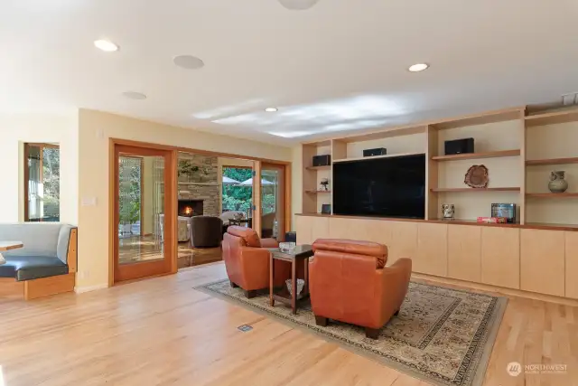 Media wall custom built cherry & maple cabinets. 75"TV.  Sound system throughout the home as well as the patio.