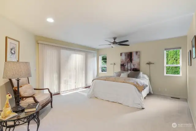 Spacious primary  bedroom w/French door to access sunroom & patio.