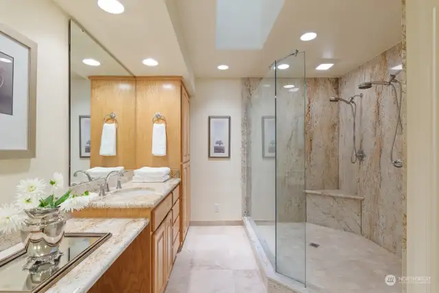 5'x8' granite walk-in double headed shower. Heated stone floor. Granite counters.
