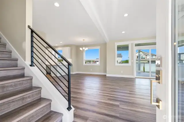 The entry brings you right into the open living room with lots of windows.
