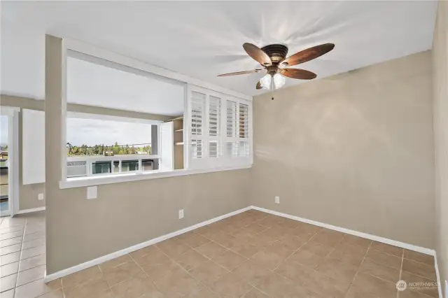 Bedroom/living room divider with shutters rolled away