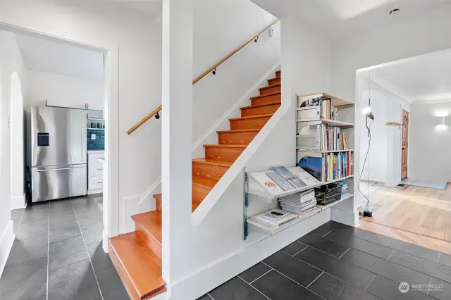 Great display shelves in the hallway and fir floors leading you upstairs.