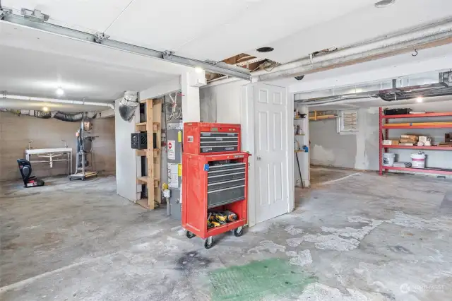 Single car garage sits underneath the home. Laundry also lives down here to the right of this photo.