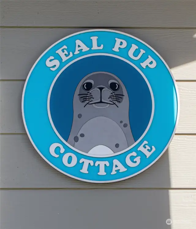 "Well hello there and welcome" The whimsical, eye-catching “Seal Pup Cottage” sign greets your guests and reminds them that it’s time to kick off their shoes, relax and get ready to play. Come on in…there’s lots to see.