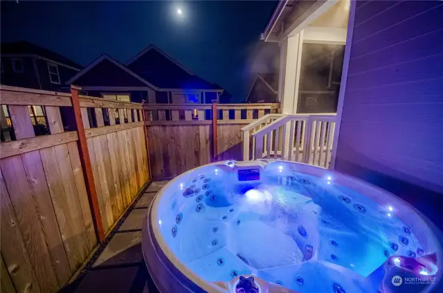 Enjoy the hot tub which is tucked away behind the fence side yard for added privacy.