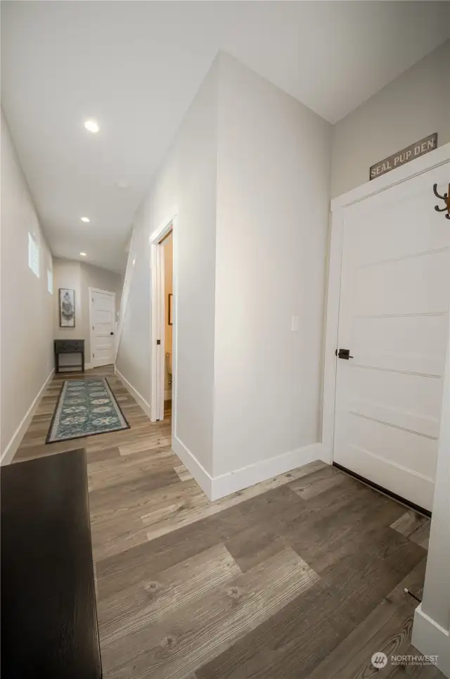 There's a coat closet to your right when you enter Seal Pup Cottage (but it's not quite visible in the photo). Right next to it is the entrance to the Seal Pup Den, a garage that has been turned into a fun-filled game room. The next door a little further down the hall on the right is a half bath and the door at the end of the hall is a very large walk-in pantry.