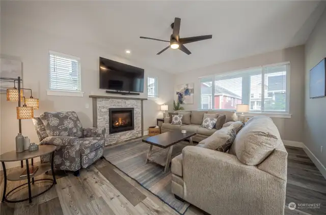 The large picture window in the living area offers a peaceful view of the beautifully landscaped common area.