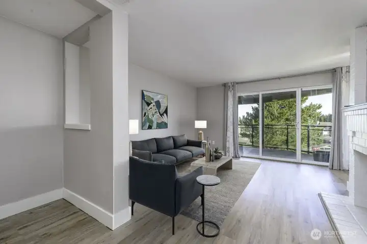 Enter into your cozy living room with fireplace! Virtually staged.