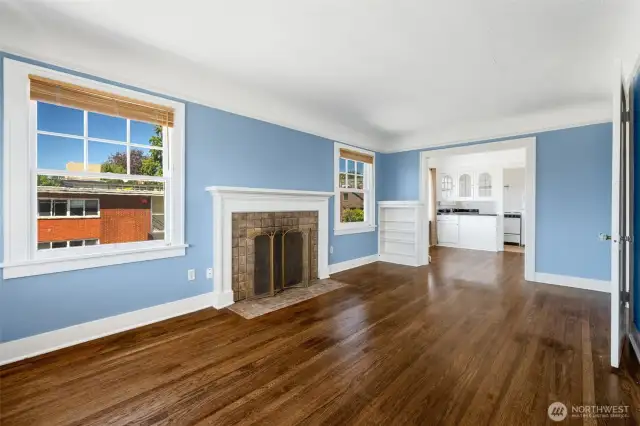 Unit 301 living room, looking into dining area and kitchen