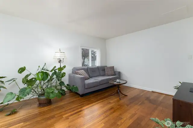Large living room is freshly painted . Oak hardwood floors have been refinished.