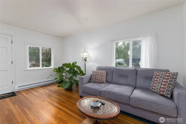 Another view of the lovely living room with lots of windows & light!
