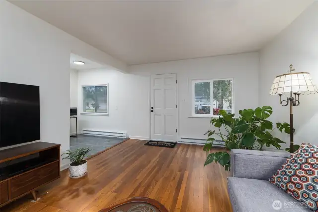 Living room opens to cozy dining room right off kitchen