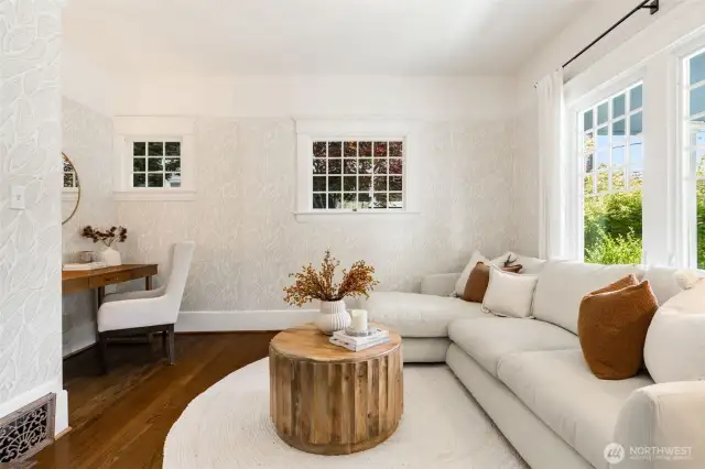 Plenty of space here for a large sectional + a desk.  There are built-in shelves in an alcove to the left of the  desk.