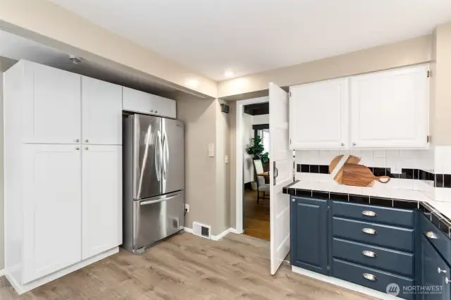 The kitchen is just off the dining room.  This wall could fairly easily be opened up for a more open layout if desired.